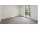 A bright and airy bedroom with a large window at 1490 Diplomat Dr, Riverdale, GA 30296