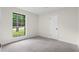 A bright and airy bedroom with a large window at 1490 Diplomat Dr, Riverdale, GA 30296