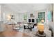 Living room featuring wood floors, fireplace, contemporary furniture, and natural light from two windows at 1490 Diplomat Dr, Riverdale, GA 30296