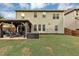 The backyard offers a well-maintained lawn, a gazebo with furniture, and a wooden fence, enhancing the property's appeal at 2376 Roberts View Trail, Buford, GA 30519