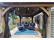 Backyard patio with a gazebo, complete with comfortable seating and an outdoor kitchen area at 2376 Roberts View Trail, Buford, GA 30519