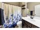 Traditional bathroom with a vanity, floral shower curtain, and neutral tones, creating a soothing space at 2376 Roberts View Trail, Buford, GA 30519