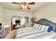 Relaxing bedroom complete with adjoining office space, ceiling fan, and soft carpeting at 2376 Roberts View Trail, Buford, GA 30519