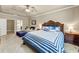 Main bedroom with vaulted ceiling, furnishings, ceiling fan, and ensuite bathroom at 2376 Roberts View Trail, Buford, GA 30519