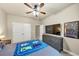 Charming bedroom with carpeted floors, closet space, a ceiling fan, and natural light at 2376 Roberts View Trail, Buford, GA 30519