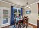 Cozy breakfast nook with a table for four, light fixture, window views, and a door leading to outdoor space at 2376 Roberts View Trail, Buford, GA 30519
