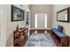 Bright and airy foyer with hardwood floors, elegant décor, and a clear view of the home's layout at 2376 Roberts View Trail, Buford, GA 30519