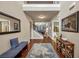 Inviting foyer with warm wood floors, stylish furnishings, and a view of the upper level balcony at 2376 Roberts View Trail, Buford, GA 30519