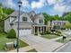 Inviting front yard with lush landscaping leading to a beautiful two-story home at 2376 Roberts View Trail, Buford, GA 30519