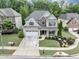 Charming two-story home with a well-manicured front yard and two-car garage at 2376 Roberts View Trail, Buford, GA 30519