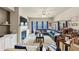 Spacious living room featuring a fireplace, built-in shelving, and an open layout to dining at 2376 Roberts View Trail, Buford, GA 30519