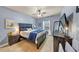 Cozy bedroom featuring a ceiling fan, modern decor, and ample natural light at 2376 Roberts View Trail, Buford, GA 30519