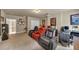This entertainment room has comfortable seating, offering relaxation for movie nights or gaming sessions at 2376 Roberts View Trail, Buford, GA 30519