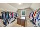 Spacious walk-in closet featuring ample shelving and storage for shoes and clothes at 2376 Roberts View Trail, Buford, GA 30519