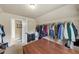 Walk-in closet with ample shelving, a clothing rack, and space for suitcases and other storage at 2376 Roberts View Trail, Buford, GA 30519