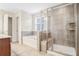 Bathroom featuring a walk-in shower and separate soaking tub at 5195 Belmore Manor Ct, Suwanee, GA 30024