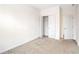 Neutral carpeted bedroom with closet and a door at 5195 Belmore Manor Ct, Suwanee, GA 30024