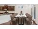 Dining room with modern chairs and table, hardwood floors, and beautiful bright light at 5195 Belmore Manor Ct, Suwanee, GA 30024