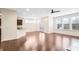 Bright open-concept living room featuring hardwood floors, recessed lighting, and access to outdoor space at 5195 Belmore Manor Ct, Suwanee, GA 30024