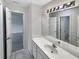 Elegant bathroom with a large mirror, ample vanity space and a neutral color scheme at 9979 Bridgewater Pointe, Villa Rica, GA 30180