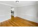 A well-lit dining room with hardwood floors and view of a kitchen at 9979 Bridgewater Pointe, Villa Rica, GA 30180