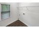 Clean laundry room featuring a window for natural light and a wire rack for storage at 9979 Bridgewater Pointe, Villa Rica, GA 30180