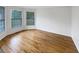 Sunlit living room featuring hardwood floors and large windows at 9979 Bridgewater Pointe, Villa Rica, GA 30180