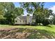Charming home with a spacious backyard, wooden deck and mature trees, perfect for outdoor relaxation and entertaining at 136 Walkers Pond Dr, Villa Rica, GA 30180