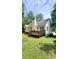 The backyard features a deck and green lawn at 136 Walkers Pond Dr, Villa Rica, GA 30180