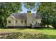 Charming home featuring a well-maintained backyard and wooden deck offering a tranquil outdoor space to enjoy at 136 Walkers Pond Dr, Villa Rica, GA 30180