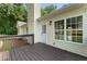 Backyard deck with railings offers a relaxing outdoor space with a door leading into the home and large window at 136 Walkers Pond Dr, Villa Rica, GA 30180