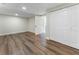 Finished basement with hardwood floors, white trim, and open layout at 136 Walkers Pond Dr, Villa Rica, GA 30180