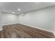 Open basement area with hardwood floors and recessed lighting at 136 Walkers Pond Dr, Villa Rica, GA 30180