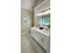 Bright bathroom with a double vanity, marble floors, large mirror and a window at 136 Walkers Pond Dr, Villa Rica, GA 30180