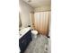 Contemporary bathroom with navy vanity, gold hardware, patterned tile floor and shower at 136 Walkers Pond Dr, Villa Rica, GA 30180