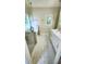 Bright bathroom with marble tile, glass shower, and gold hardware at 136 Walkers Pond Dr, Villa Rica, GA 30180