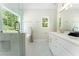 Bright bathroom featuring a large window, shower and bathtub at 136 Walkers Pond Dr, Villa Rica, GA 30180