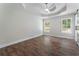 Spacious bedroom with hardwood flooring, windows, and ceiling with fan at 136 Walkers Pond Dr, Villa Rica, GA 30180