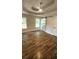 Bright bedroom features trey ceilings, luxury vinyl flooring, and a stylish barn door at 136 Walkers Pond Dr, Villa Rica, GA 30180