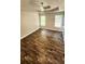 Spacious bedroom features trey ceilings, luxury vinyl flooring, and windows at 136 Walkers Pond Dr, Villa Rica, GA 30180