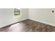 Bedroom interior with light-colored walls, hardwood floors, and a window at 136 Walkers Pond Dr, Villa Rica, GA 30180