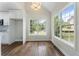 Bright breakfast nook adjacent to the kitchen, with hardwood floors and lots of natural light at 136 Walkers Pond Dr, Villa Rica, GA 30180