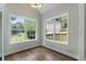 Cozy breakfast nook with hardwood floors and large windows offering views of the surrounding neighborhood at 136 Walkers Pond Dr, Villa Rica, GA 30180