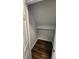Walk-in closet with wood floor and wire shelves for storage at 136 Walkers Pond Dr, Villa Rica, GA 30180