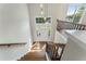 Bright foyer featuring hardwood floors, stylish lighting, and a staircase with wrought iron railings at 136 Walkers Pond Dr, Villa Rica, GA 30180