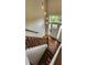 Elegant entryway with dark hardwood floors, a view of the stairs, and hanging pendant lighting at 136 Walkers Pond Dr, Villa Rica, GA 30180