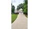 Lovely two-story home with a spacious driveway, attached two-car garage, and lush green front yard at 136 Walkers Pond Dr, Villa Rica, GA 30180