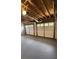 A three car garage with painted floor and overhead door at 136 Walkers Pond Dr, Villa Rica, GA 30180