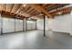 Spacious garage features two overhead doors, exposed ceiling, gray floor and ample room for vehicles and storage at 136 Walkers Pond Dr, Villa Rica, GA 30180