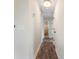 Hallway with wood flooring leading to a bathroom and other rooms in the house at 136 Walkers Pond Dr, Villa Rica, GA 30180